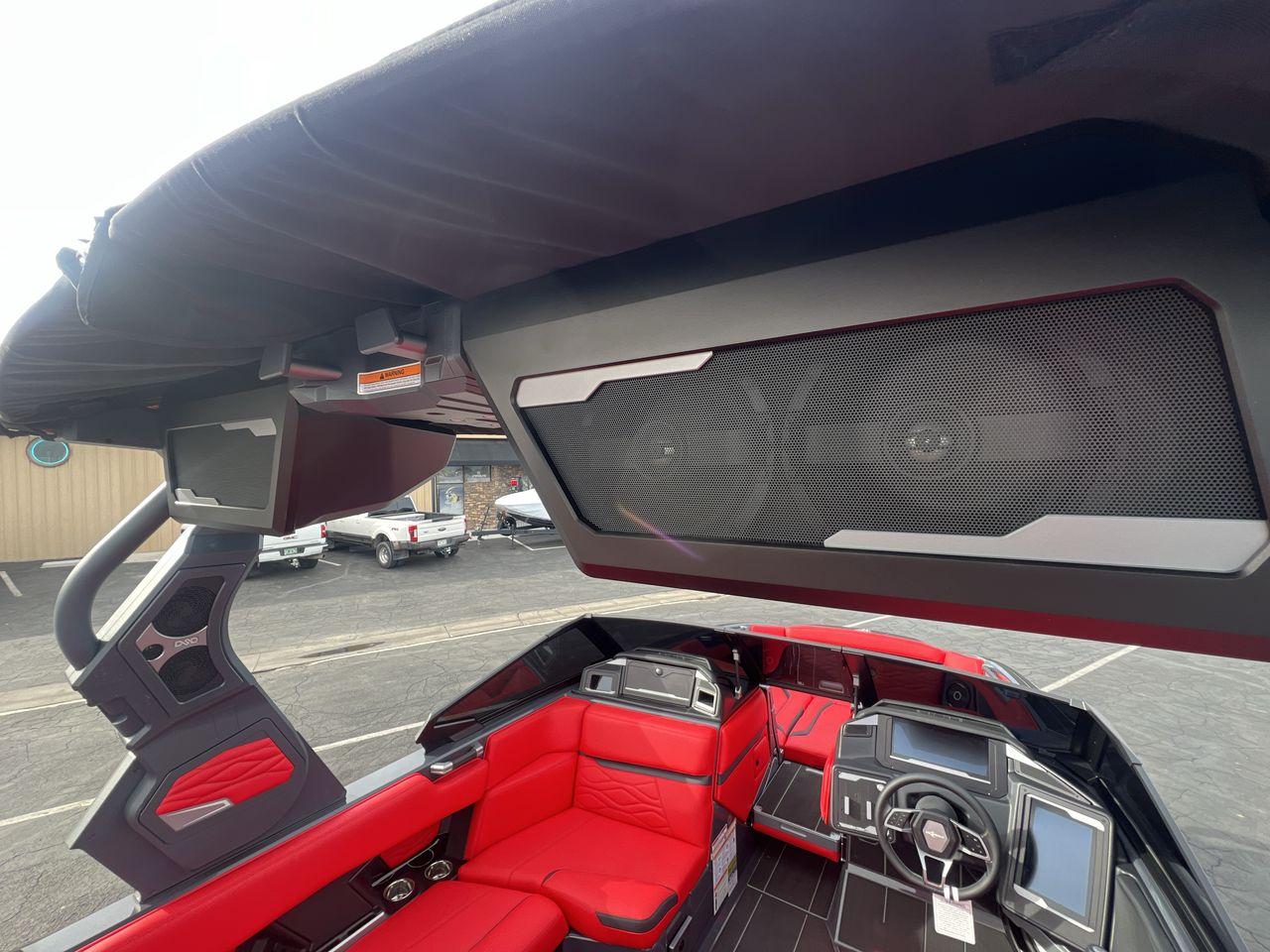 Slide: The Image of 2025 Supra SA boat interior with red seating and advanced audio system. - 21