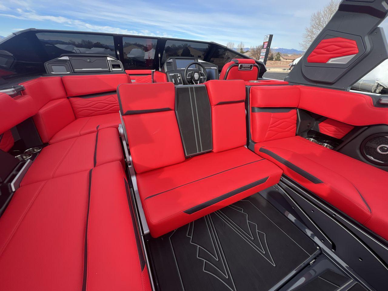 Slide: The Image of 2025 Supra SA interior with luxurious red and black seating, modern design. - 24