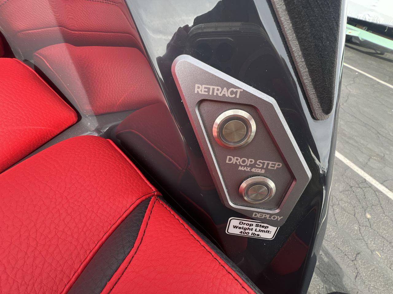 Slide: The Image of Red leather interior with drop step controls in a 2025 Supra SA vehicle. - 27