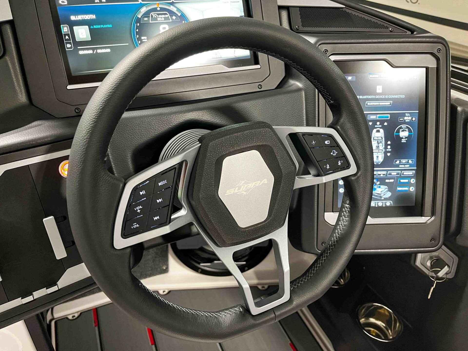 Slide: The Image of 2024 Supra SA400 steering wheel and dashboard with advanced digital displays. - 21
