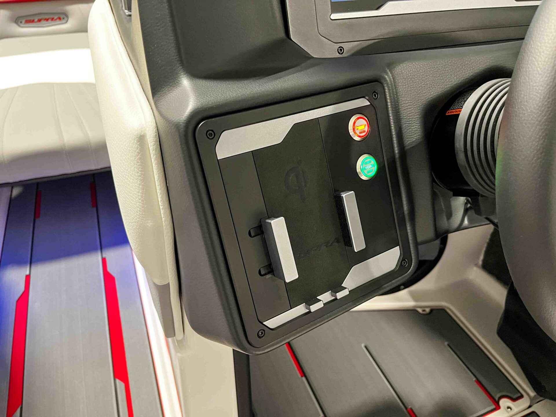 Slide: The Image of 2024 Supra SA400 boat dashboard with control panel and seating area. - 22