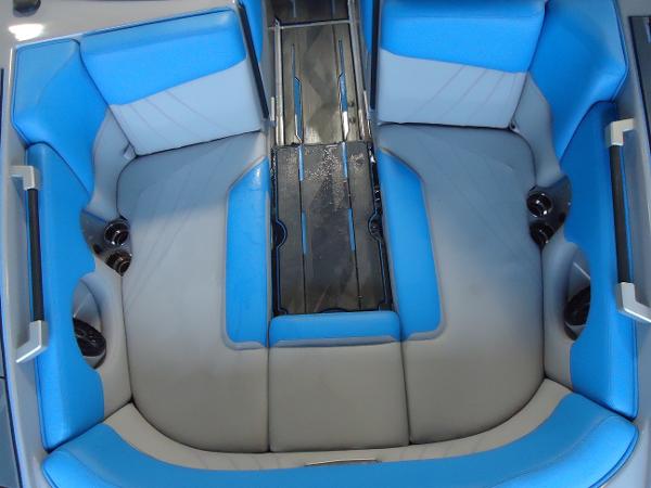 Slide: The Image of 2022 Supra SA 450 boat interior with blue and gray seating. - 1