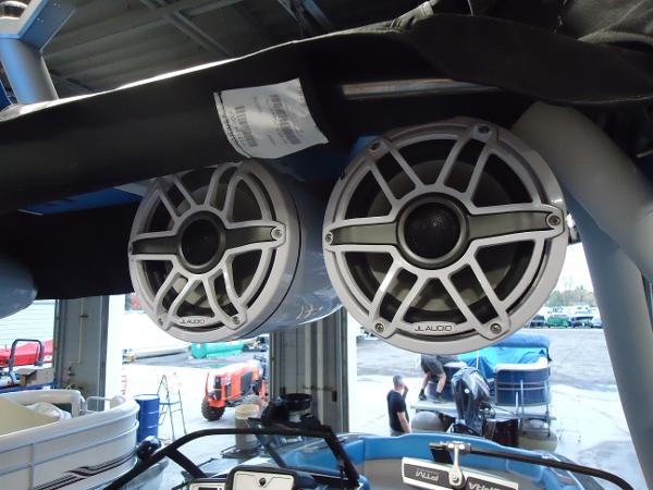 Slide: The Image of 2022 Supra SA 450 boat with JL Audio speakers in a garage. - 15