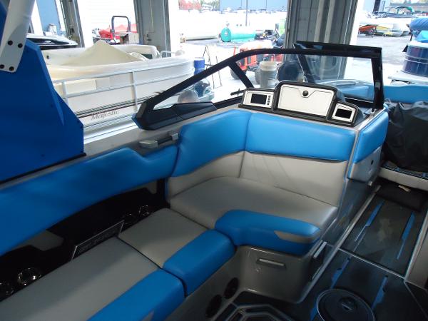 Slide: The Image of 2022 Supra SA 450 boat interior with blue and gray seating. - 3