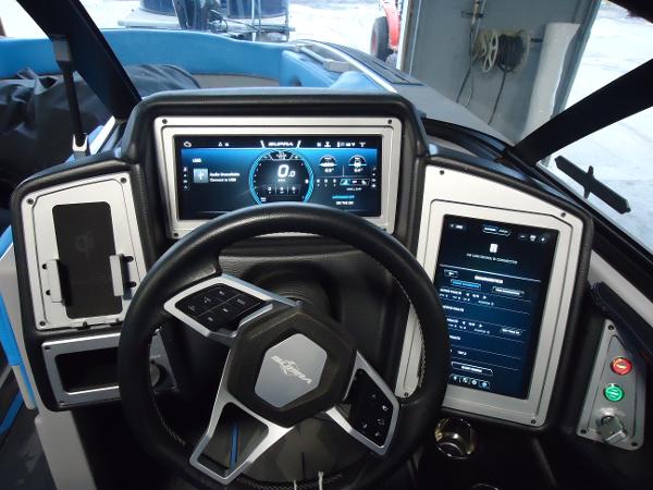 Slide: The Image of 2022 Supra SA 450 dashboard with advanced digital displays and steering wheel. - 6