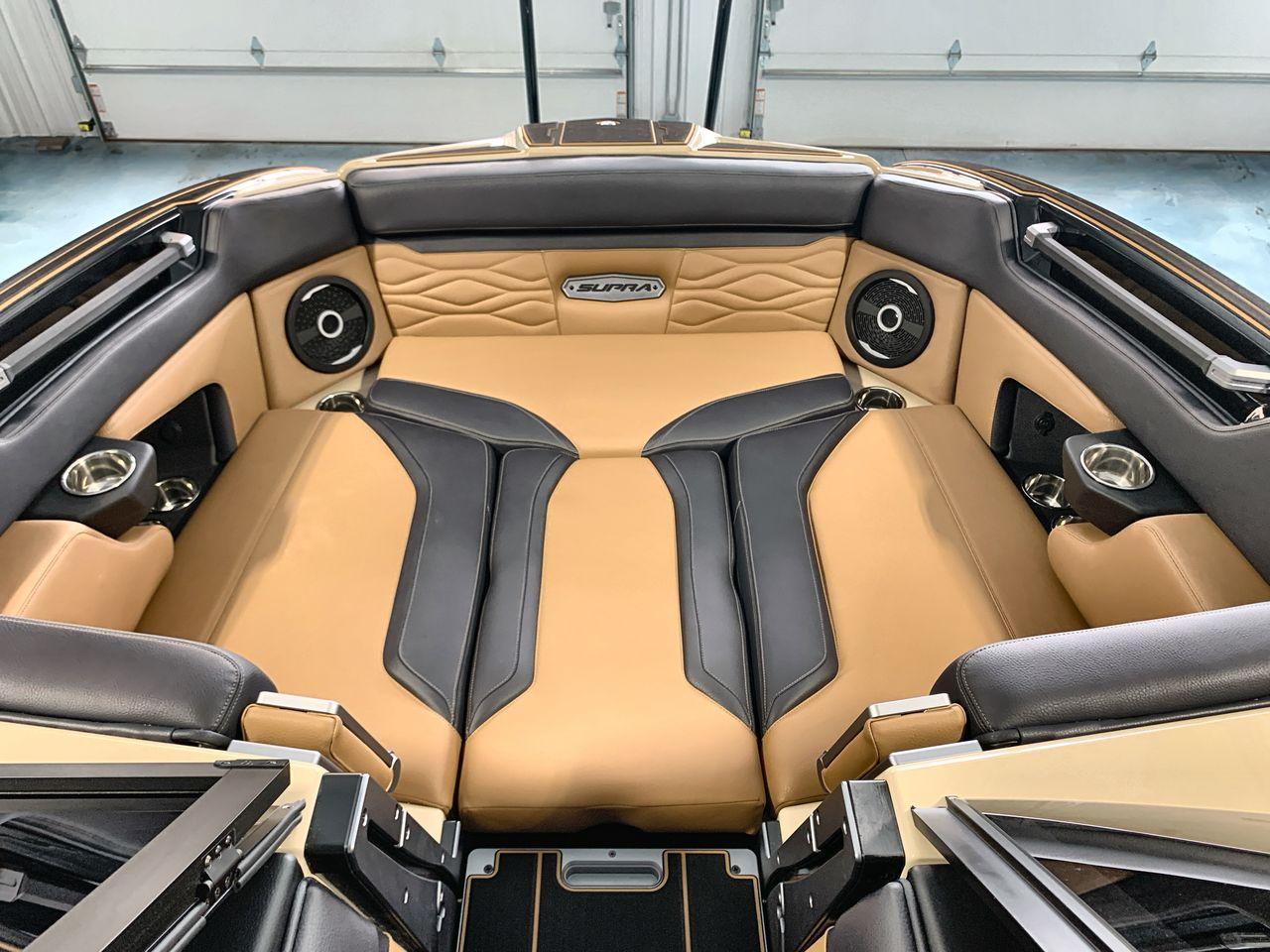 Slide: The Image of Luxurious interior of 2025 Supra SE boat with tan and black leather seating. - 10