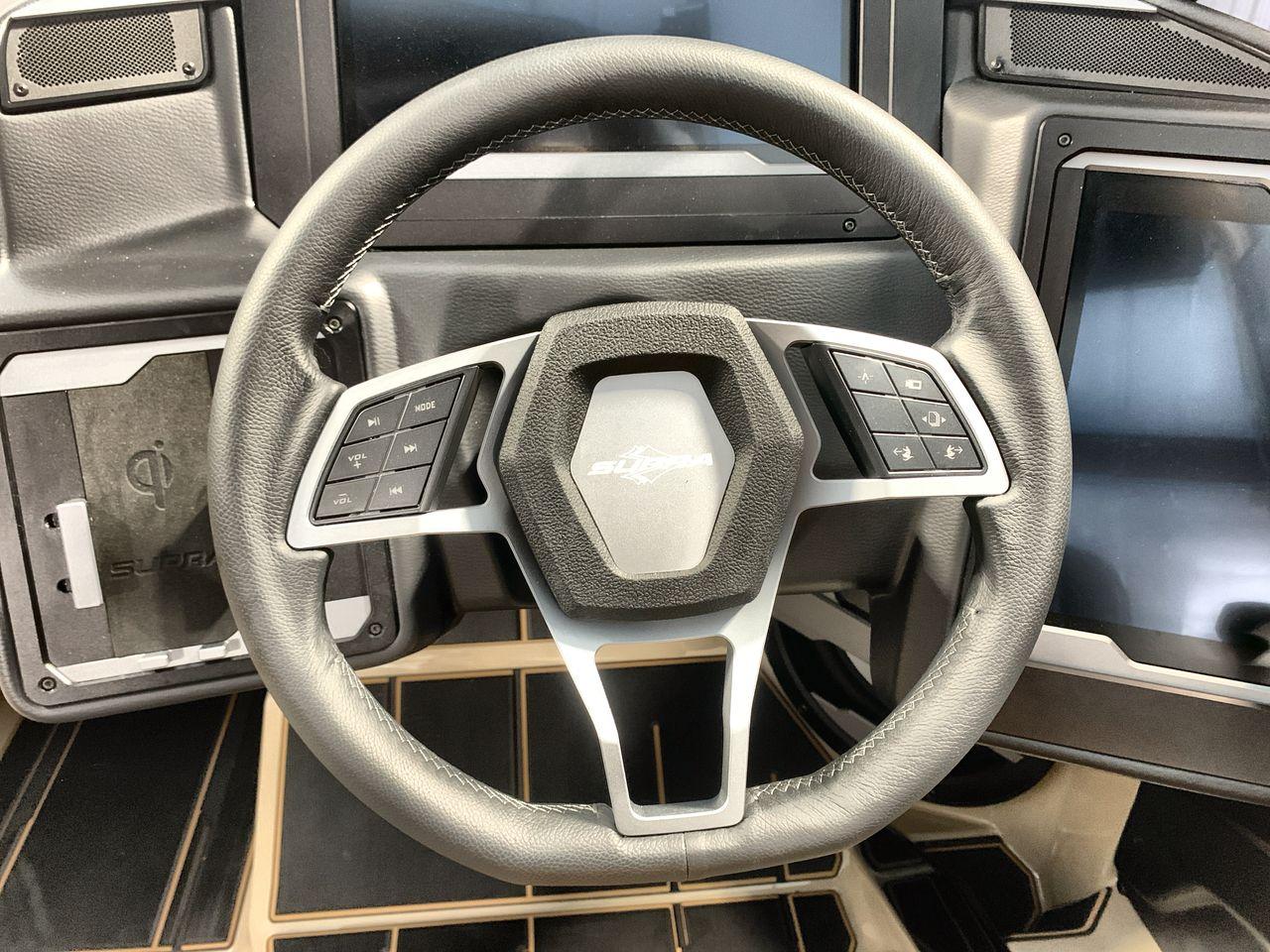 Slide: The Image of Steering wheel of 2025 Supra SE with integrated controls and modern dashboard design. - 13