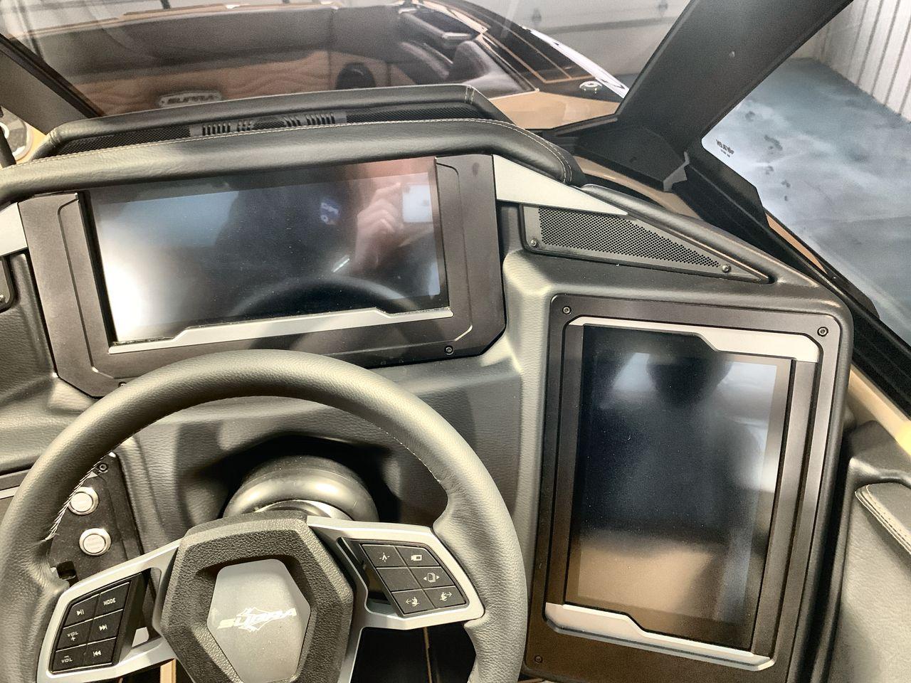Slide: The Image of 2025 Supra SE dashboard with dual touchscreens and modern steering wheel design. - 14