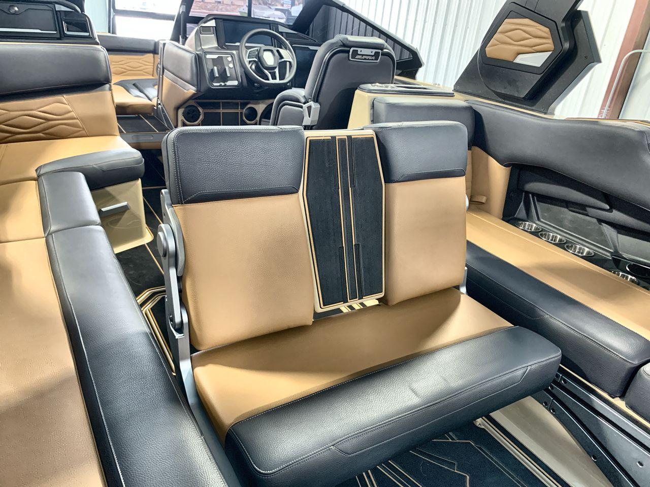 Slide: The Image of 2025 Supra SE interior with luxurious tan and black seating, modern dashboard, and sleek design. - 23