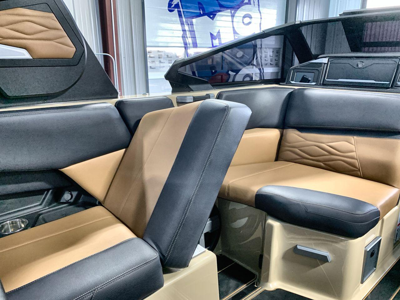 Slide: The Image of 2025 Supra SE interior with black and tan leather seating. - 24