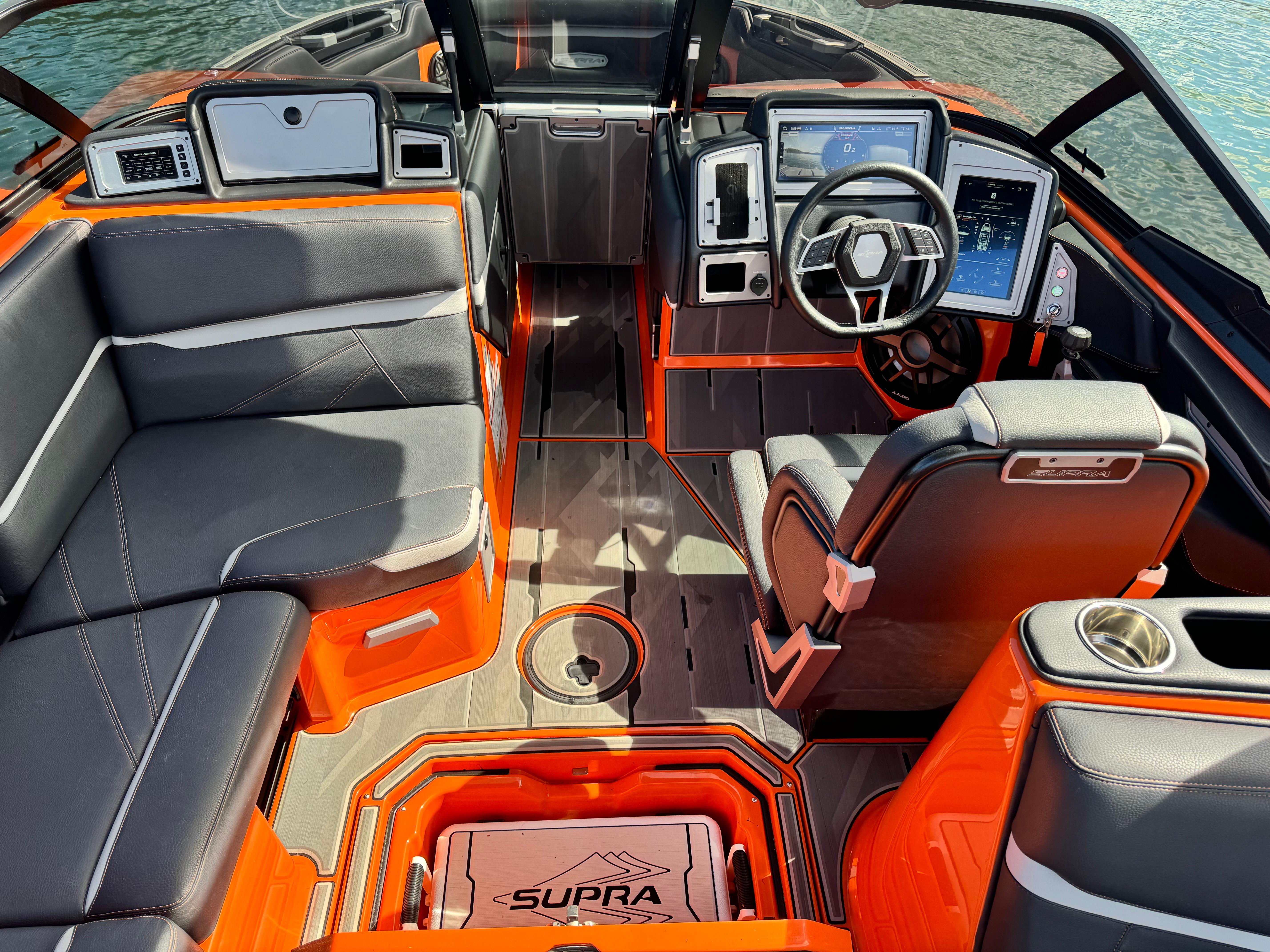 Slide: The Image of 2022 Supra SL 550 boat interior with modern dashboard and seating. - 4