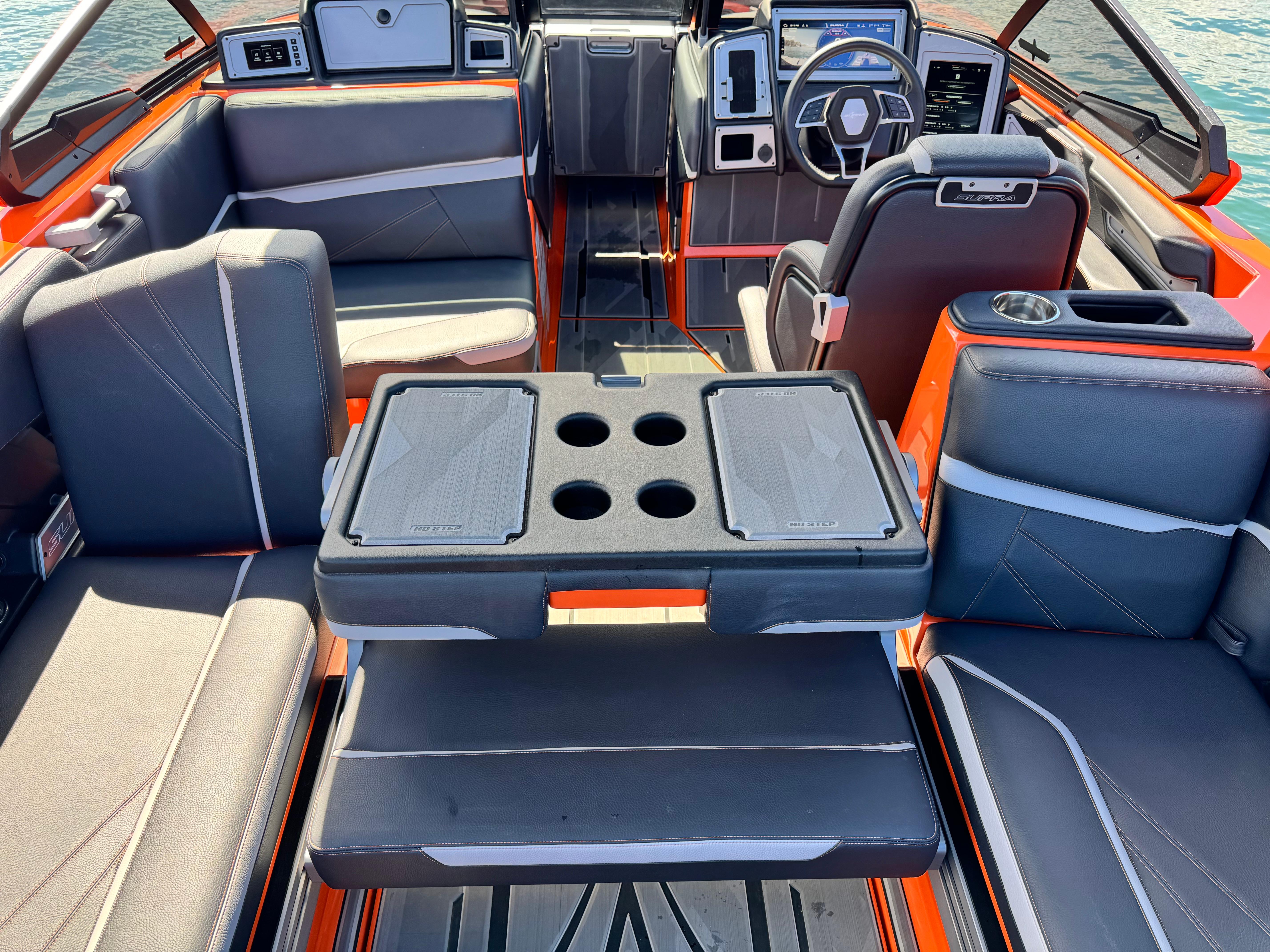 Slide: The Image of 2022 Supra SL 550 boat interior with modern seating and control panel. - 8