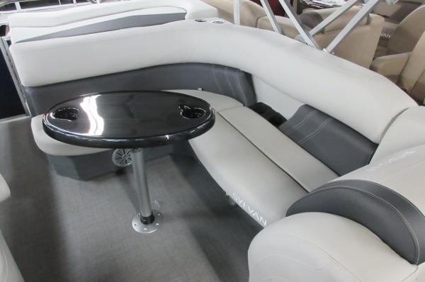 Slide: The Image of 2023 Sylvan 820 Mirage Cruise RE interior with plush seating and sleek table design. - 4