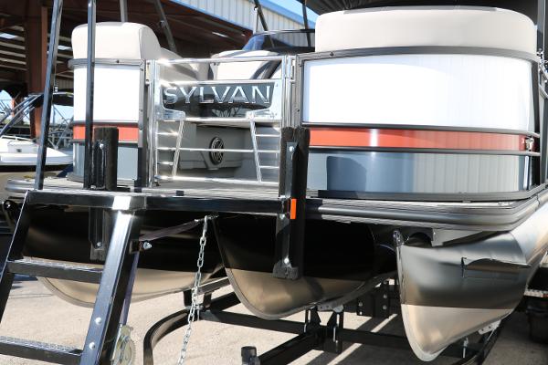 Slide: The Image of 2025 Sylvan L3 DLZ Bar Tri-Toon pontoon boat rear view with ladder and logo. - 11