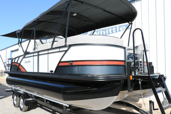 Slide: The Image of 2025 Sylvan L3 DLZ Bar Tri-Toon pontoon boat with black canopy on trailer. - 14