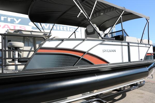 Slide: The Image of 2025 Sylvan L3 DLZ Bar Tri-Toon pontoon boat with sleek design and canopy. - 17