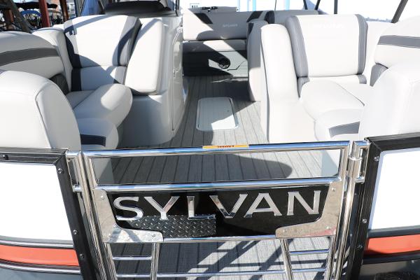Slide: The Image of 2025 Sylvan L3 DLZ Bar Tri-Toon interior with luxurious seating and sleek design. - 19