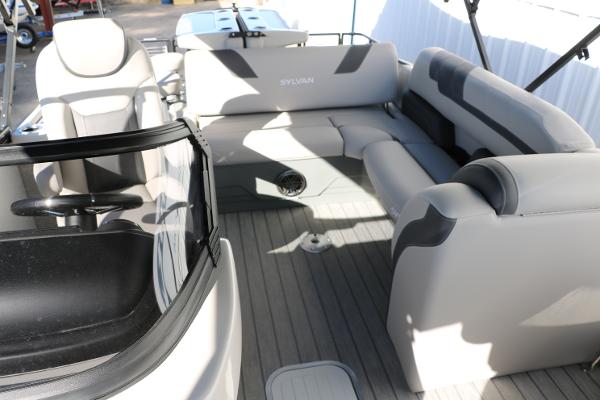 Slide: The Image of 2025 Sylvan L3 DLZ Bar Tri-Toon interior with gray seating and sleek design. - 24