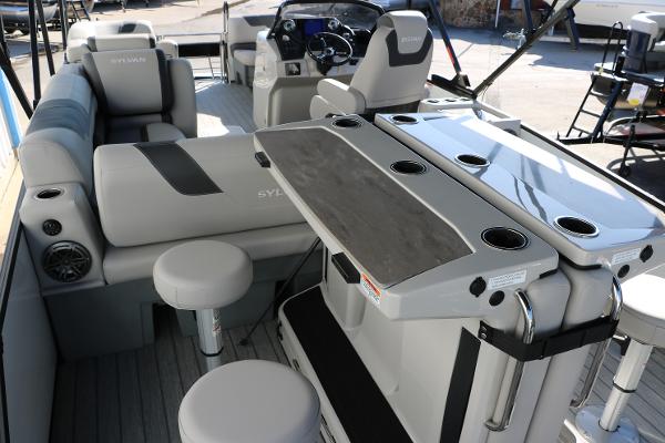Slide: The Image of 2025 Sylvan L3 DLZ Bar Tri-Toon interior with seating and bar area. - 25