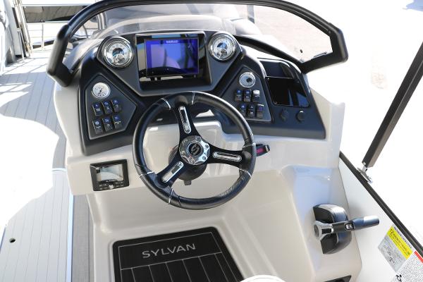 Slide: The Image of Cockpit of 2025 Sylvan L3 DLZ Bar Tri-Toon with modern controls and steering wheel. - 38