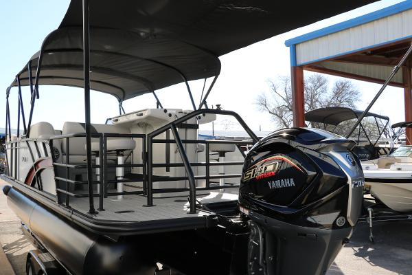 Slide: The Image of 2025 Sylvan L3 DLZ Bar Tri-Toon boat with Yamaha engine, docked outdoors. - 5