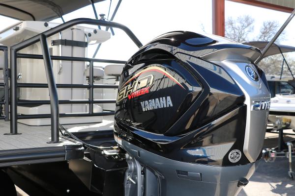 Slide: The Image of 2025 Sylvan L3 DLZ Bar Tri-Toon with Yamaha outboard motor, docked and ready for adventure. - 6