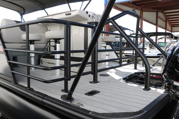 Slide: The Image of 2025 Sylvan L3 DLZ Bar Tri-Toon boat with sleek deck and seating area. - 7