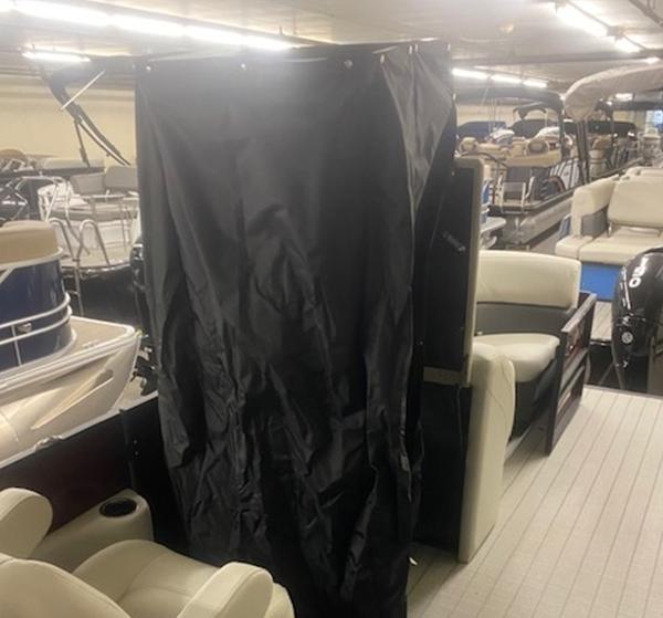 Slide: The Image of 2024 Sylvan Mirage 8522 LZ pontoon boat interior with black privacy curtain. - 5