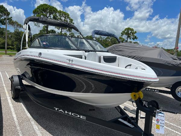Slide: The Image of 2024 Tahoe 185 S boat on trailer under blue sky. - 0
