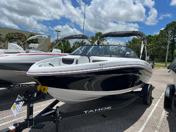 Slide: The Image of 2024 Tahoe 185 S boat on trailer under blue sky. - 1