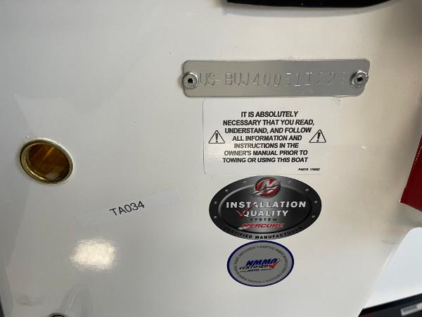 Slide: The Image of Tahoe 1950 boat identification plate with safety instructions and manufacturer labels, model year 2023. - 13