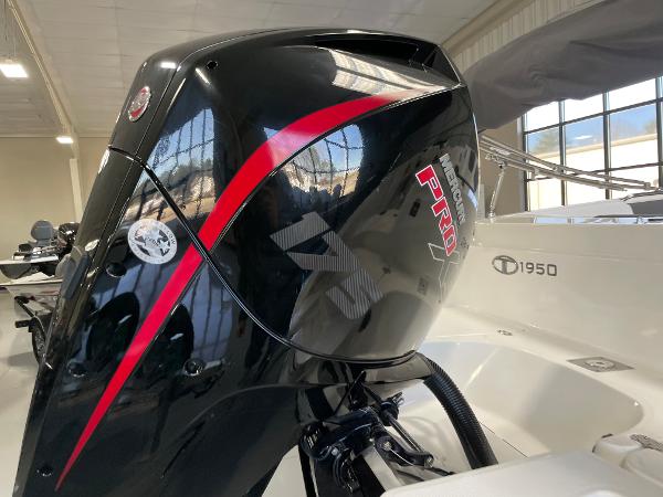 Slide: The Image of Tahoe 1950 boat with a powerful black and red Pro outboard motor, 2023 model. - 5