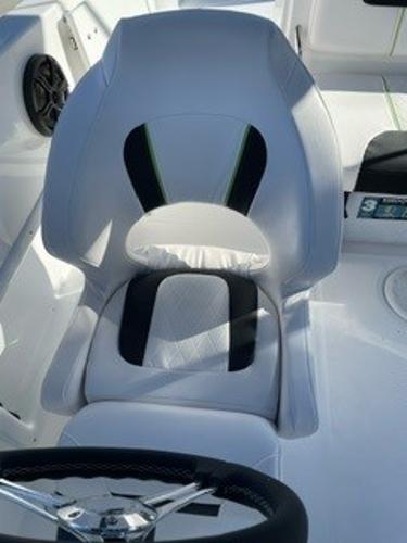 Slide: The Image of 2024 Tahoe 1950 boat seat, white and black design, modern interior. - 7