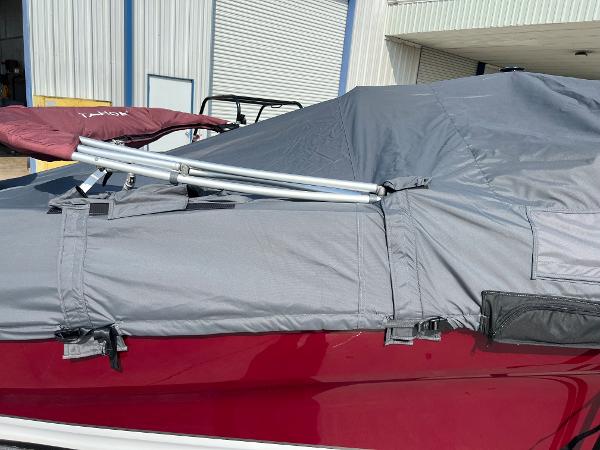 Slide: The Image of 2023 Tahoe 200 S boat with protective cover in storage facility. - 11