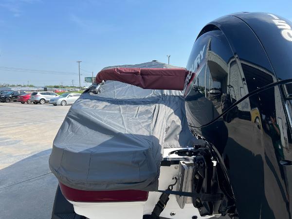 Slide: The Image of 2023 Tahoe 200 S boat with Mercury outboard motor in parking lot. - 13