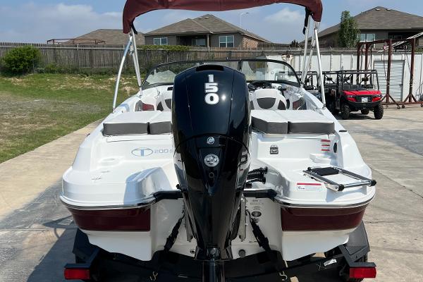 Slide: The Image of 2023 Tahoe 200 S boat with 150 HP outboard motor, parked on a driveway. - 3