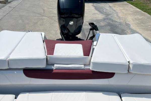 Slide: The Image of 2023 Tahoe 200 S boat with white and red seating, black outboard motor. - 4