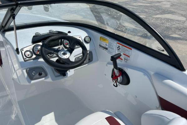 Slide: The Image of 2023 Tahoe 200 S boat cockpit with steering wheel and control panel. - 5