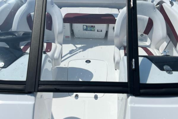 Slide: The Image of 2023 Tahoe 200 S boat interior with white and maroon seats. - 9