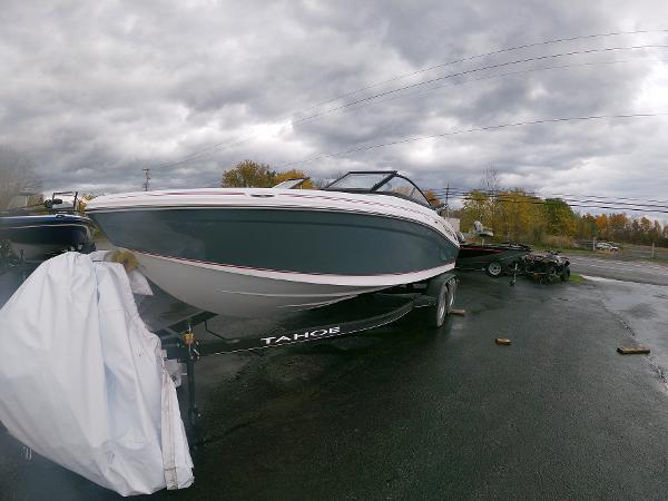 Slide: The Image of 2024 Tahoe 210 S boat on trailer under cloudy sky. - 4