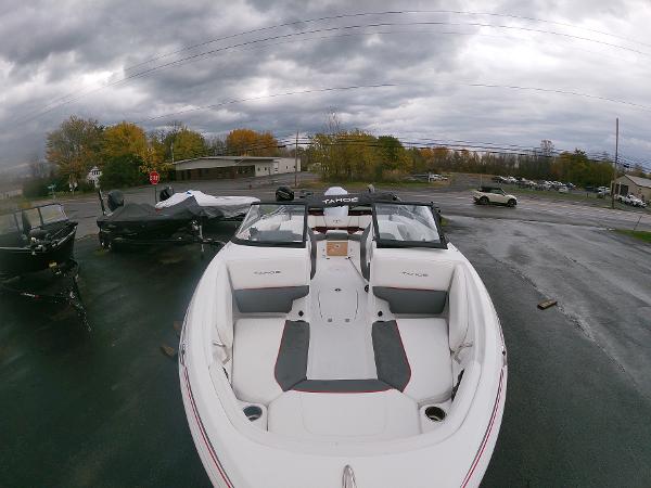 Slide: The Image of 2024 Tahoe 210 S boat on display in a parking lot. - 5
