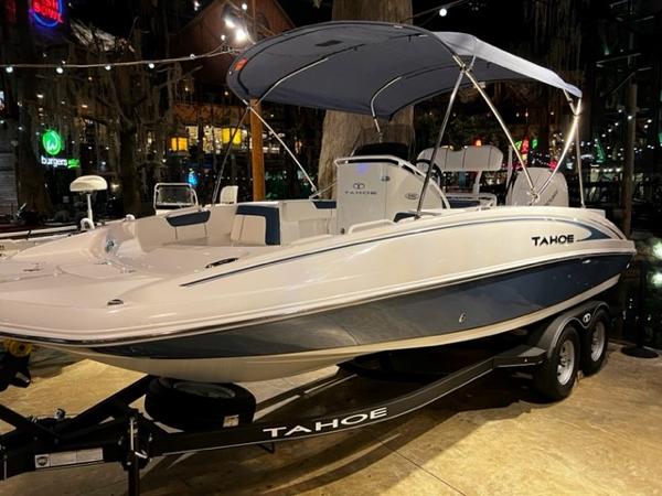 Slide: The Image of 2024 Tahoe 2150 CC boat on trailer with canopy in showroom. - 1