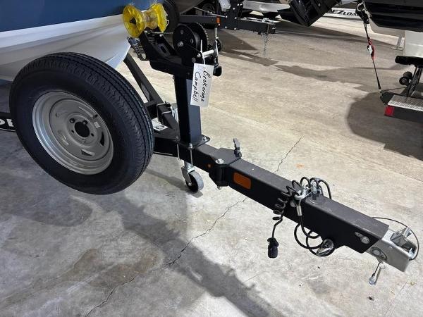 Slide: The Image of Trailer hitch of a 2020 Tahoe 450 TF boat in a garage setting. - 10