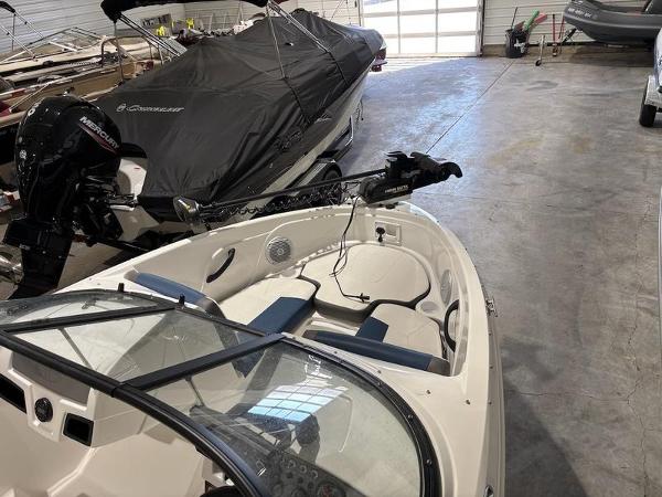 Slide: The Image of 2020 Tahoe 450 TF boat in storage, featuring a sleek design and modern equipment. - 12