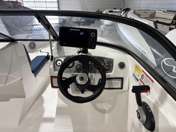 Slide: The Image of Cockpit of 2020 Tahoe 450 TF boat with steering wheel and control panel. - 4