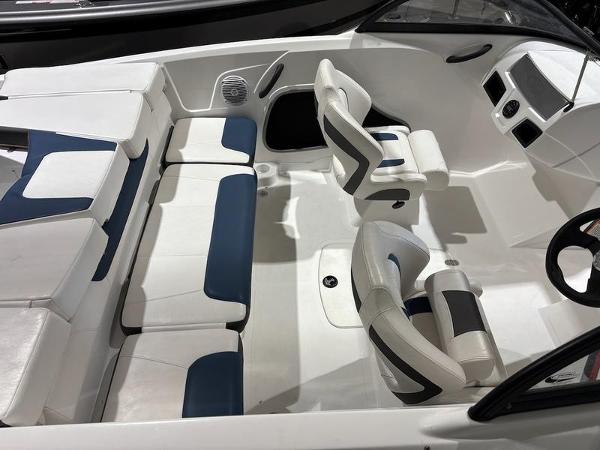 Slide: The Image of 2020 Tahoe 450 TF boat interior with white and blue seating, modern design. - 7