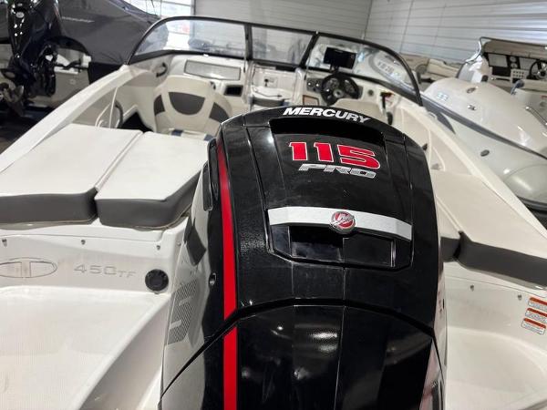 Slide: The Image of 2020 Tahoe 450 TF boat with Mercury 115 Pro outboard engine in showroom. - 8
