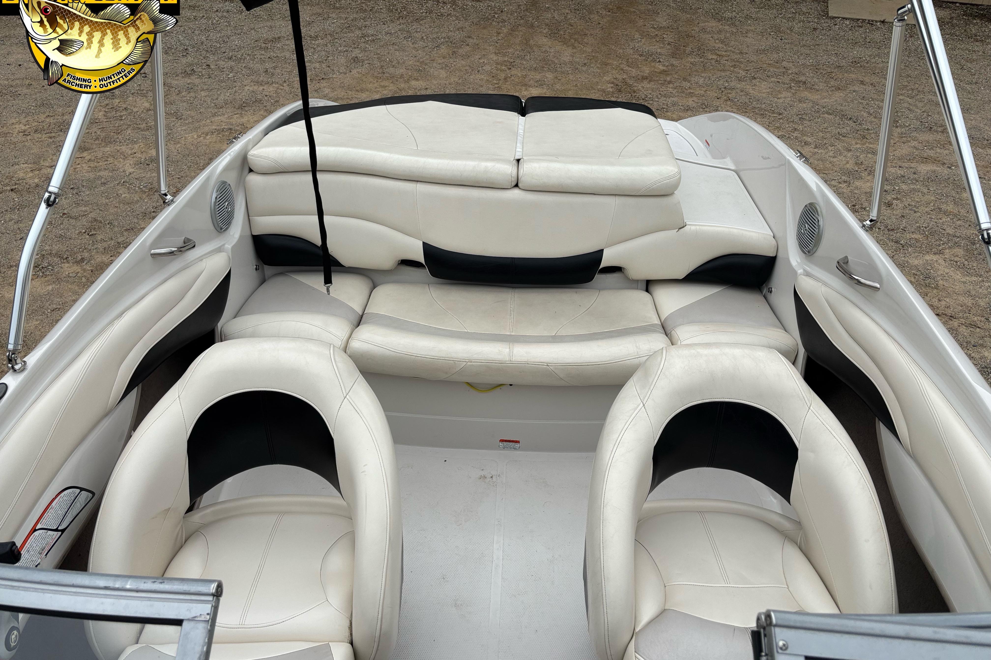 Slide: The Image of 2011 Tahoe Q7i boat interior with white leather seating and black accents. - 28