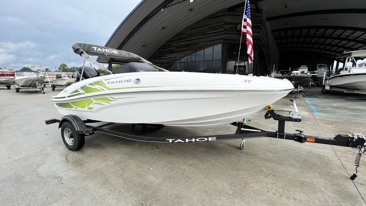 Slide: The Image of 2021 Tahoe T16 boat on trailer in marina. - 1