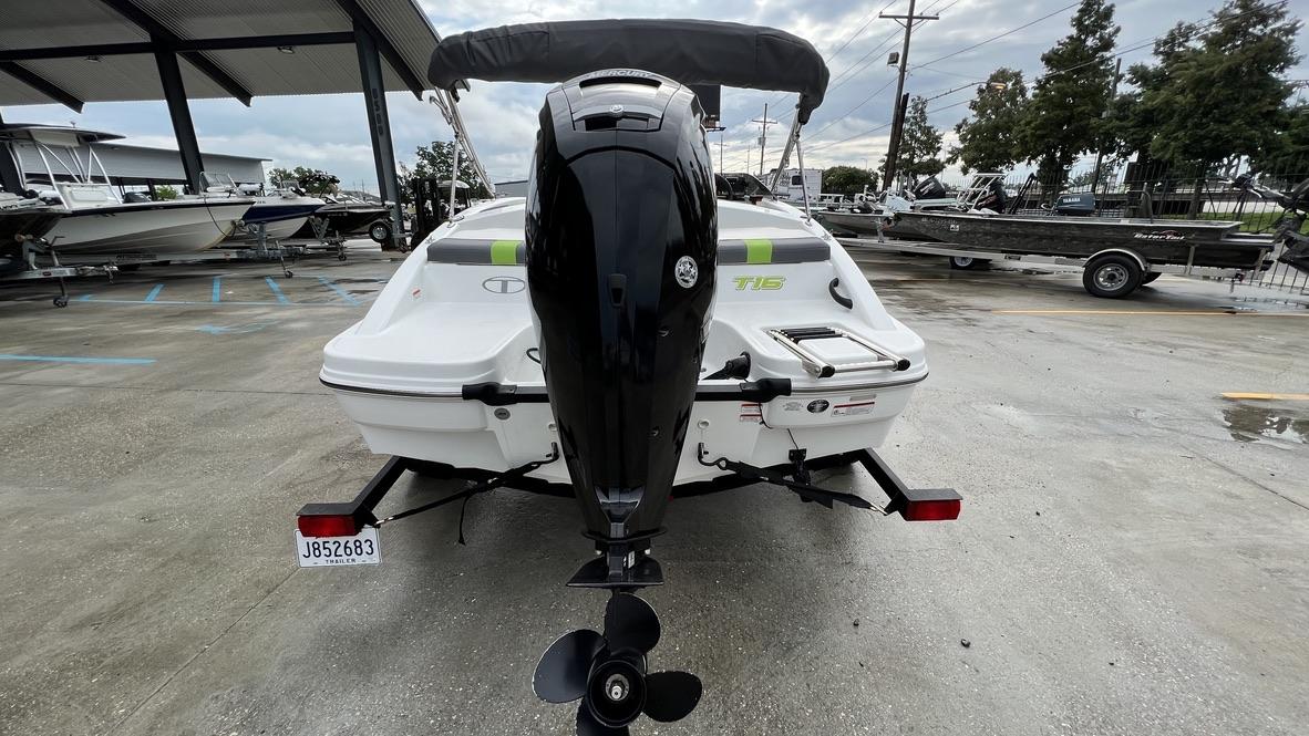 Slide: The Image of 2021 Tahoe T16 boat with outboard motor on trailer in marina. - 12